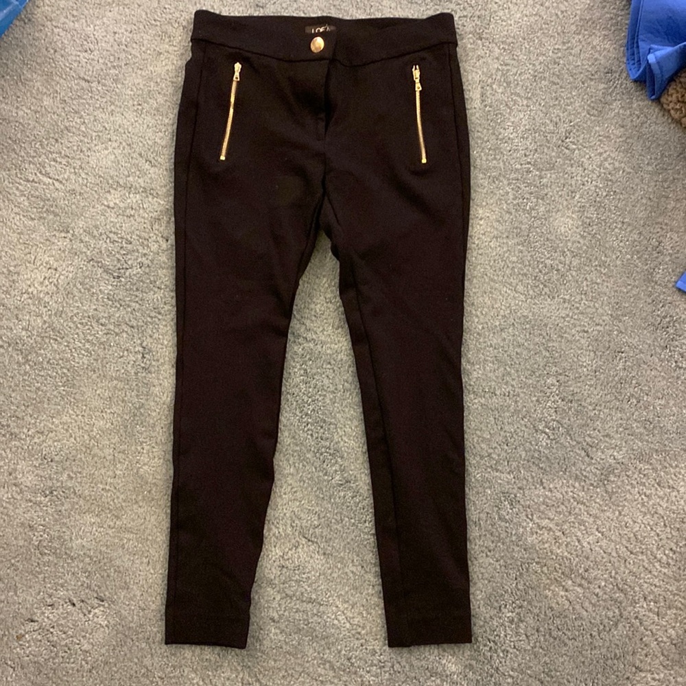 Black dress pants. Tight fit.